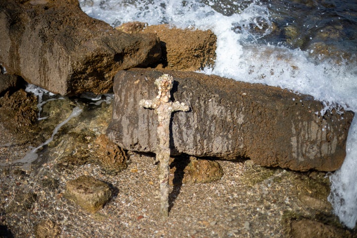 Israel's Antiquities Authority said Monday a scuba diver was on a weekend dive in northern Israel last Saturday when he spotted a trove of ancient artifacts that included anchors, pottery and the sword.