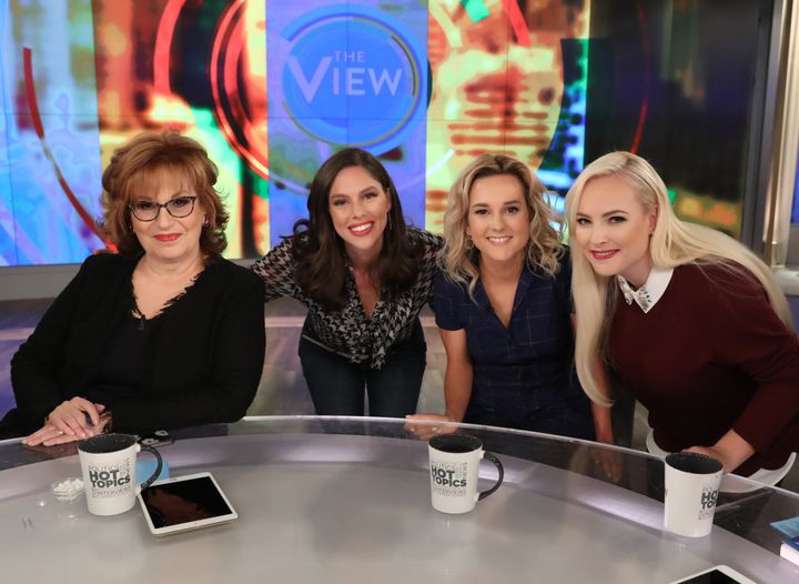 Joy Behar and Meghan McCain pictured with guests after a 2018 episode of “The View.”