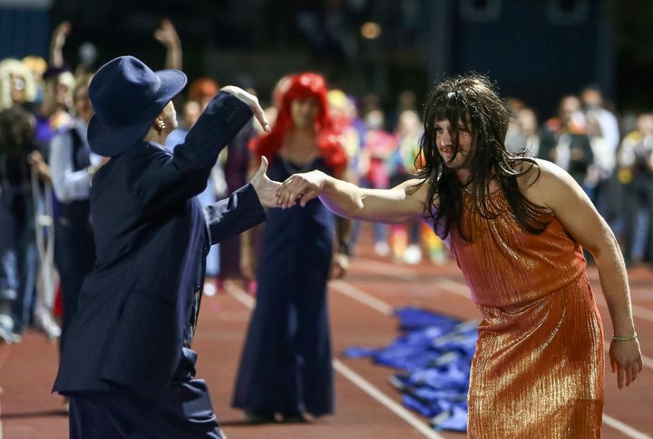 Students and faculty participate in the “drag ball" halftime show at Burlington High School on Oct. 15.