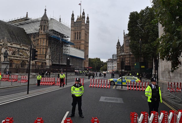 Members of Parliament walk from the Houses of Parliament to attend a service to pay tribute to