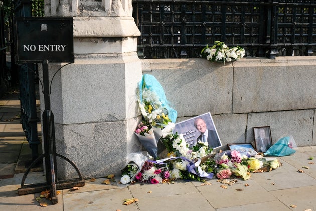 Floral tributes for Sir David Amess, outside the entrance to the Houses of
