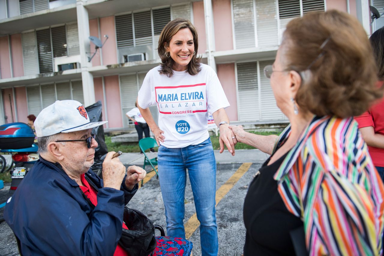 Maria Elvira Salazar, then a Republican candidate for Florida's 27th Congressional District, talks with voters at a Miami-Dade County housing facility on Nov. 6, 2018.