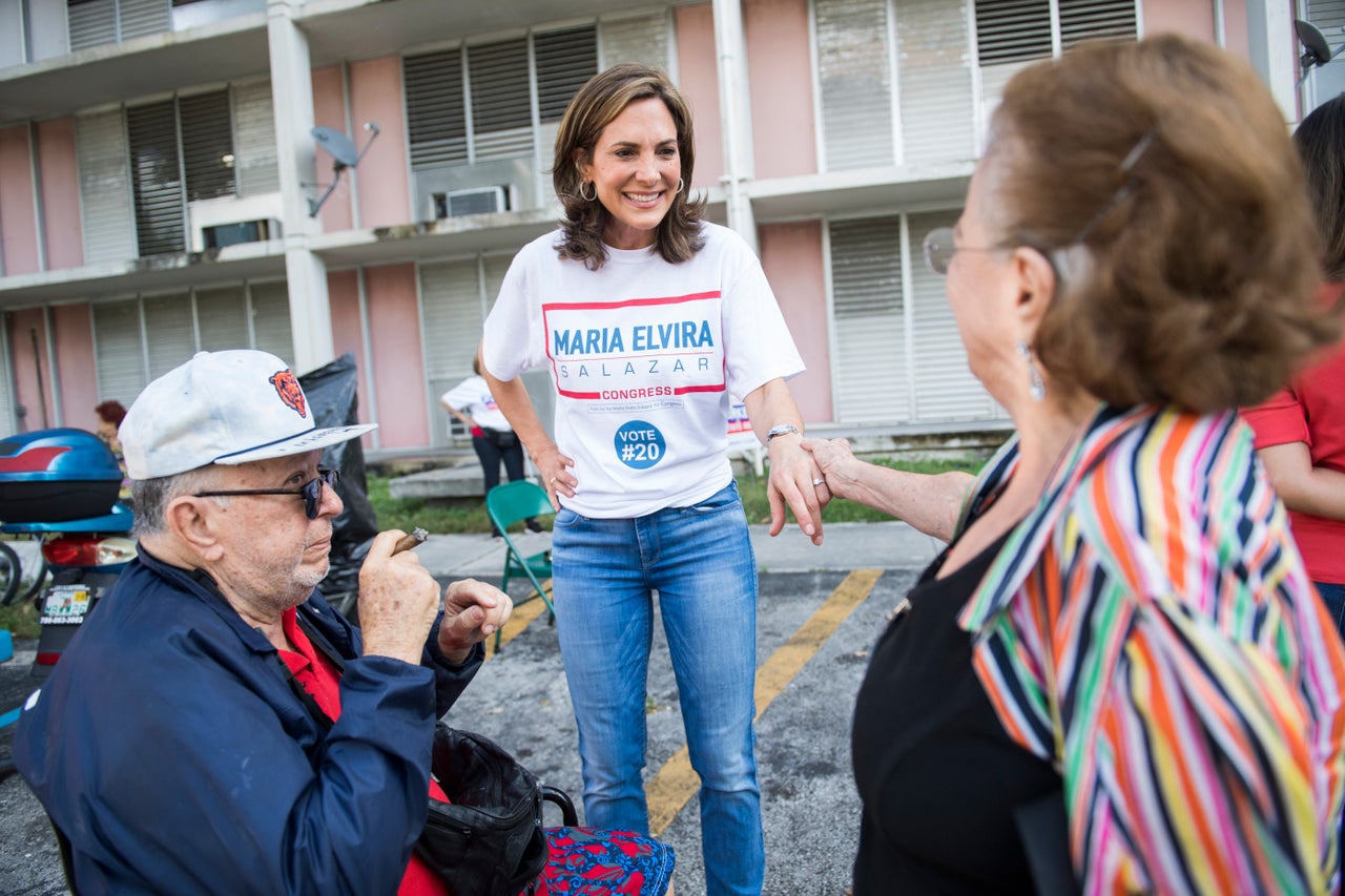 Maria Elvira Salazar, then a Republican candidate for Florida's 27th Congressional District, talks with voters at a Miami-Dade County housing facility on Nov. 6, 2018.