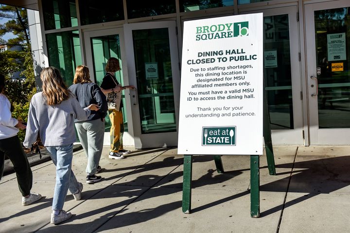 A sign outside a dining hall at Michigan State University on Sept. 30, 2021. Dining halls at the school have been affected by a lack of workers. The school is asking professors and others to volunteer to work a few hours. (Nick King/Lansing State Journal via AP)