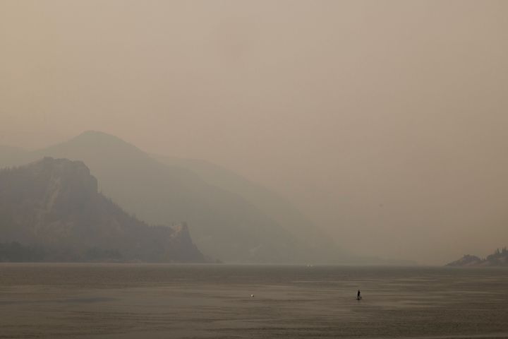 A lone paddleboarder on the Columbia River in Oregon during an abnormal heat wave in the Pacific Northwest on Aug. 13.