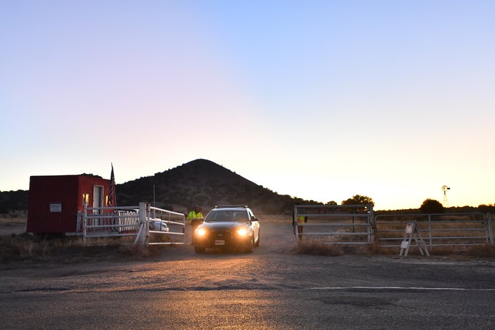 A Santa Fe County Sheriff's Office car leaves through the entrance to the Bonanza Creek Ranch, where the movie "Rust" was being filmed, on Oct. 22, 2021, in Santa Fe, New Mexico.