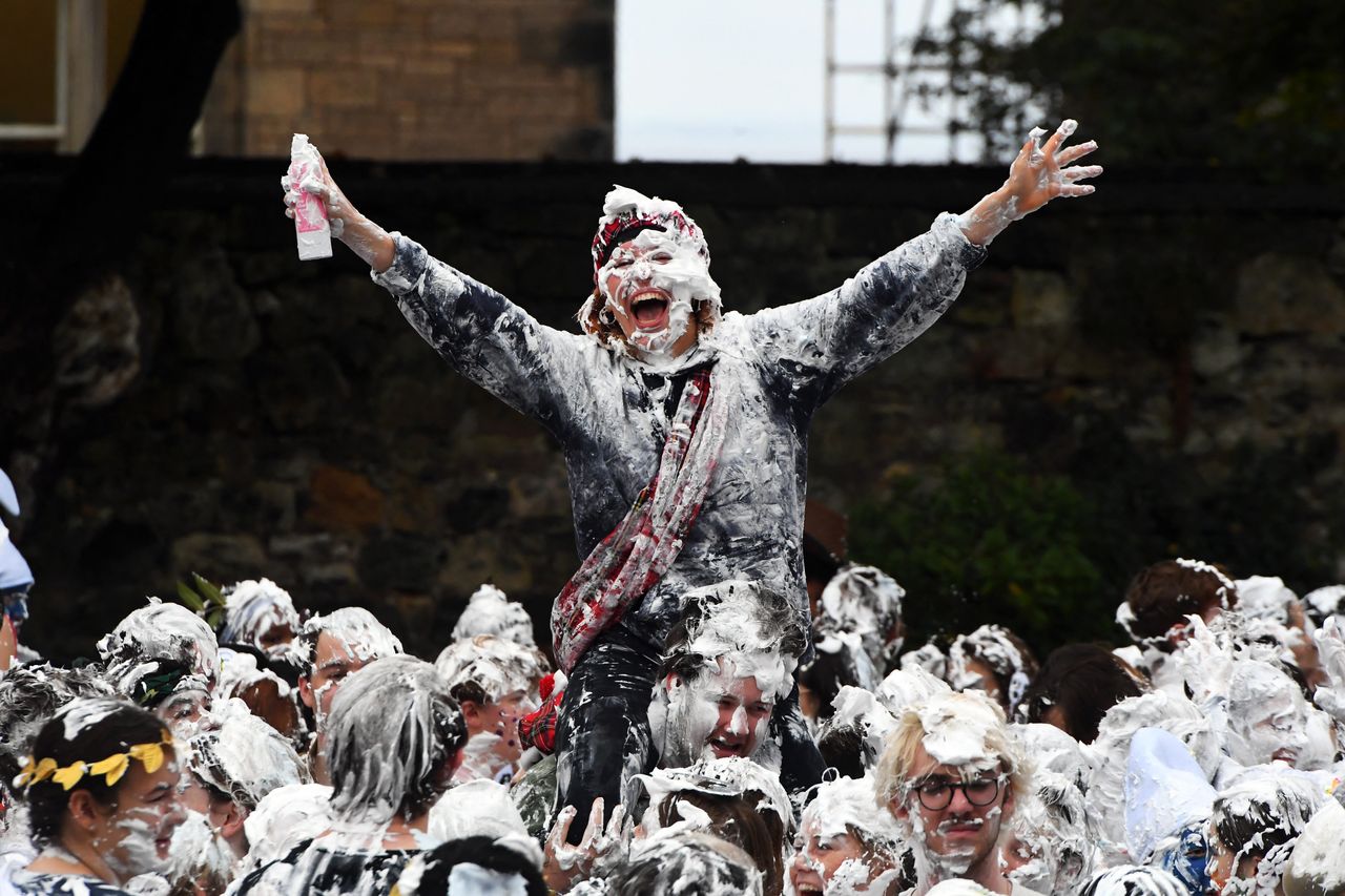 First year students at the University of St. Andrews participate in the annual Raisin Monday shaving foam fight, on Oct. 18. The Raisin Monday costumed foam fight is the culmination of a week of mentoring to welcome first year students.