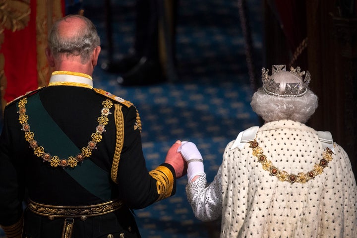 Queen Elizabeth II and Prince Charles attend the state opening of Parliament in 2019.