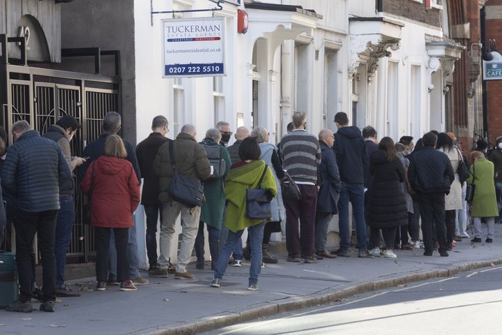 People lined up outside a vaccination center in London to receive a COVID-19 vaccine or booster shot on Thursday. COVID-19 cases have been rising in the U.K. since early September.