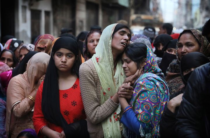 Relatives and neighbors on Feb. 27, 2020, wail near the body of Mohammad Mudasir, who was killed in communal violence in New Delhi, India. Facebook in India has been selective in curbing hate speech, misinformation and inflammatory posts, particularly anti-Muslim content, according to leaked documents.