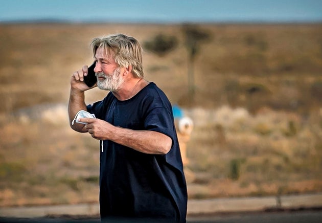 Alec Baldwin speaks on the phone in the parking lot outside the Santa Fe County Sheriff's Office in Santa...