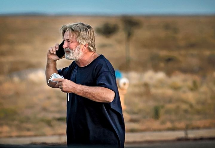 Alec Baldwin speaks on the phone in the parking lot outside the Santa Fe County Sheriff's Office in Santa Fe, N.M., after he was questioned about a shooting on the set of the film Rust.