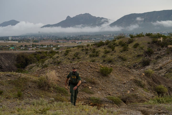 U.S. Border Patrol Agent Joel Freeland patrols at the base of Mount Christo Rey in Sunland Park, New Mexico on September 1, 2021.