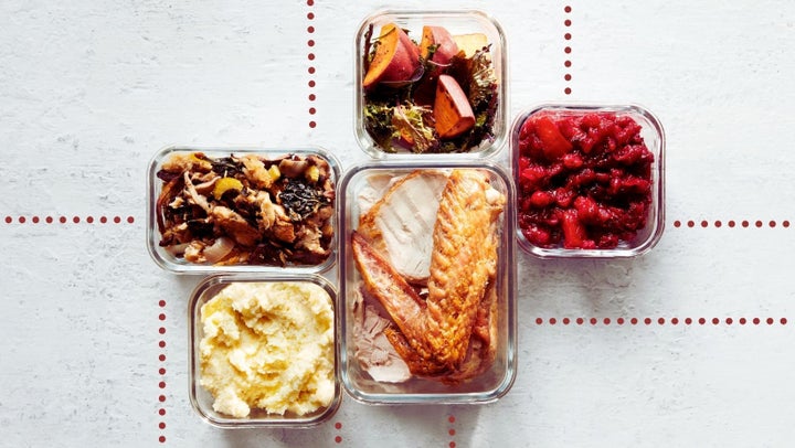 Takeout to-go containers of holiday turkey dinners with turkey