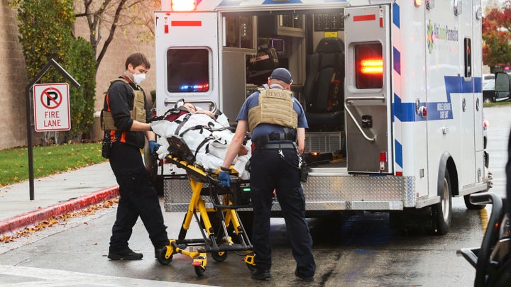 First responders take care of people who were inside the Boise Towne Square shopping mall when a man opened fire.