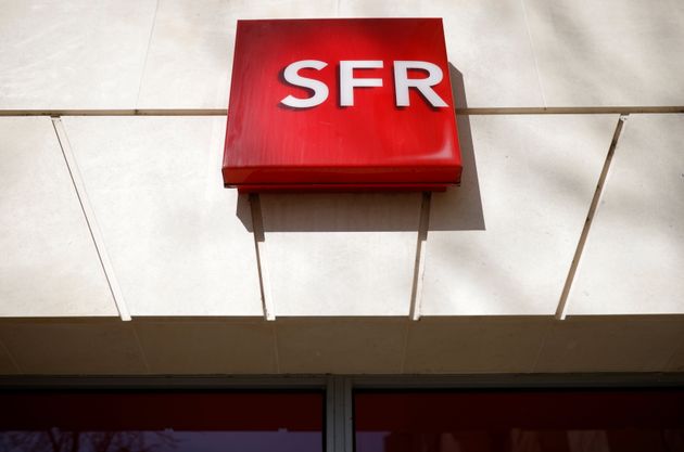 The logo of French telecoms operator SFR is pictured on a shop in Niort, France, March 4, 2021. REUTERS/Stephane Mahe