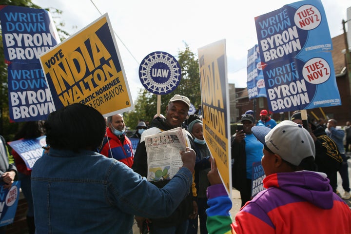 Supporters of Byron Brown, including some union members, interact with supporters of India Walton on Saturday.