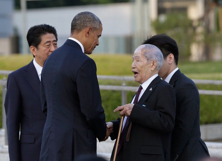 In this 2016 file photo, Sunao Tsuboi, right, talks with then U.S. President Barack Obama.