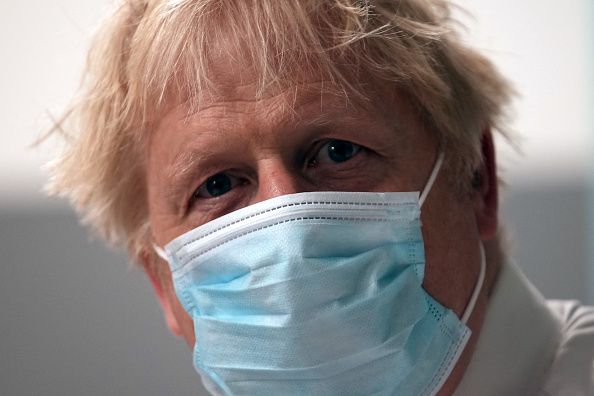 Johnson wearing a mask at the beginning of