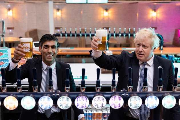 Boris Johnson and Rishi Sunak raise a pint as they visit Fourpure Brewery in Bermondsay, London, following...
