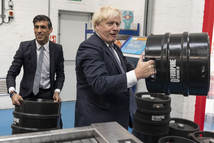 Boris Johnson and Rishi Sunak during a visit to Fourpure Brewery in Bermondsey, London, holding 30 litre kegs. The proposed new policy only applies to containers of 40 litres-plus.
