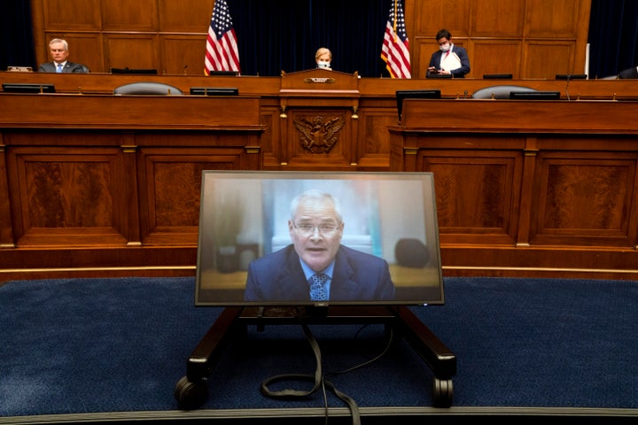 Darren Woods, CEO of ExxonMobil, testifies via video conference during a House Committee on Oversight and Reform hearing on the role of fossil fuel companies in climate change on Thursday.