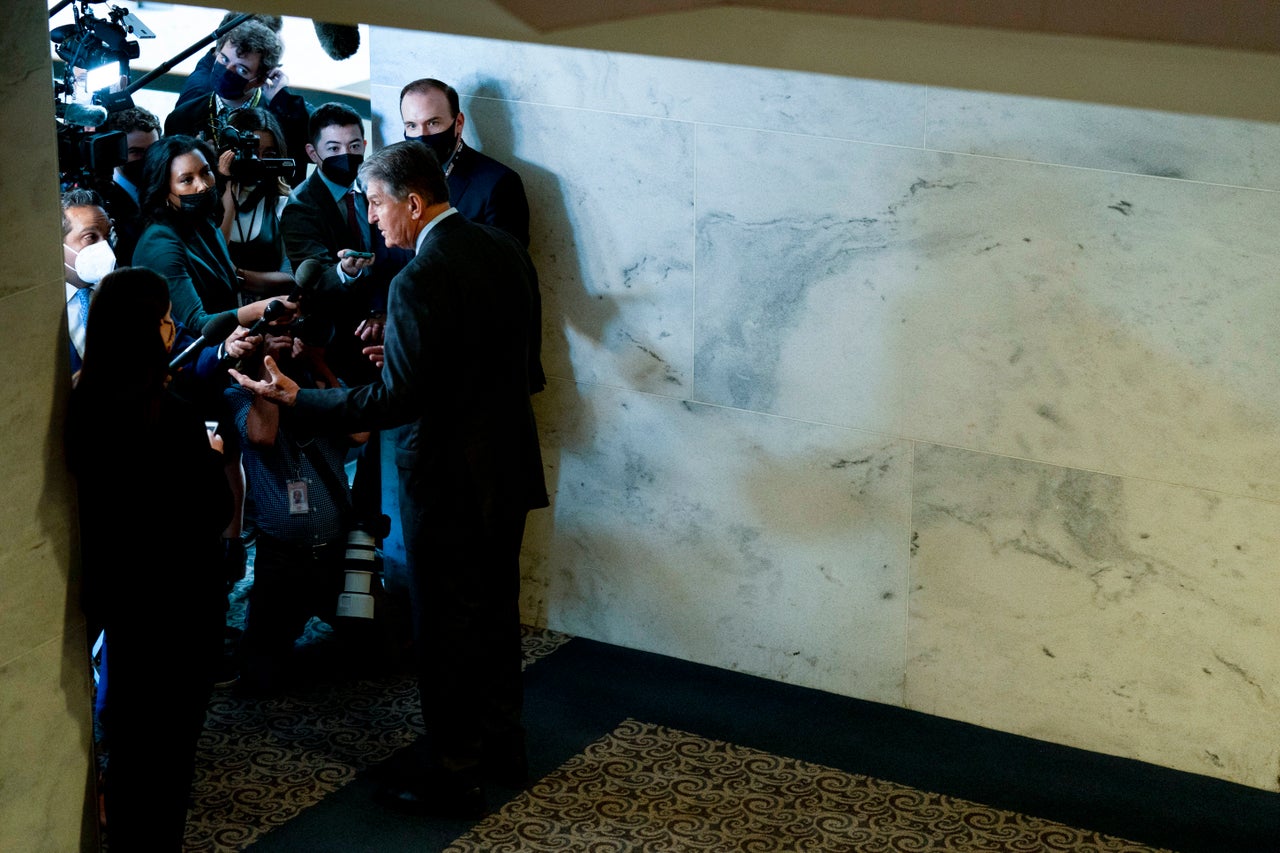 Sen. Joe Manchin (D-W.Va.), a key holdout vote on Biden's domestic agenda, speaks to reporters on Capitol Hill in Washington, D.C., on Wednesday.