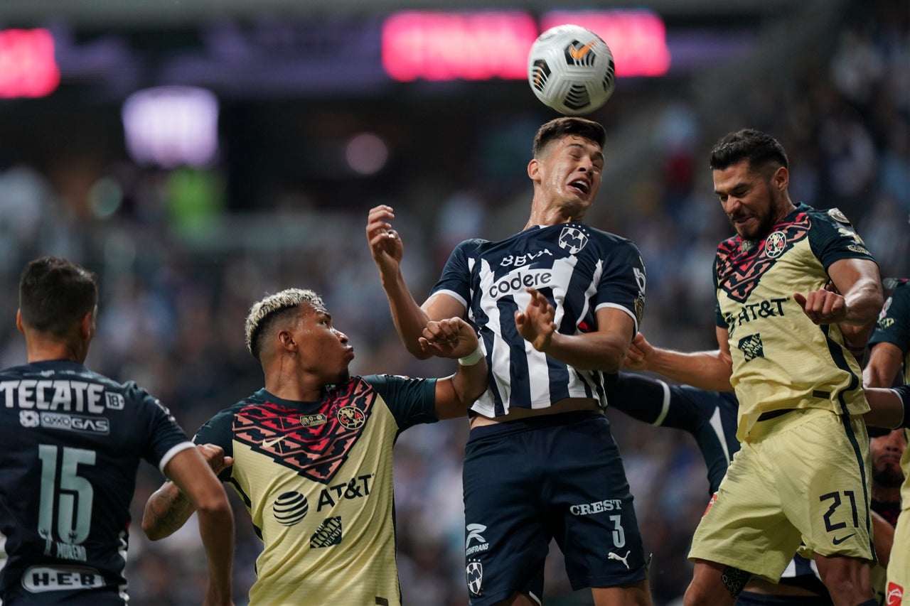 César Montes of Mexico's Monterrey clears the ball challenged by Henry Martin of Mexico's America during the Concacaf Champions League final soccer match in Monterrey, Mexico, on Thursday.