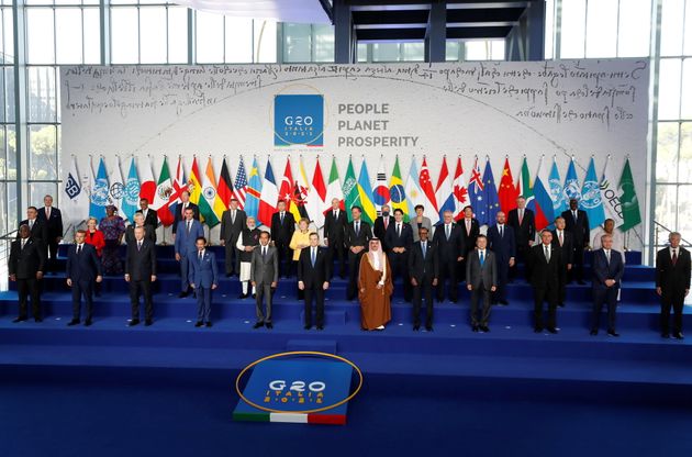 G20 state leaders pose during a family photo session at the start of the G20 summit in Rome, Italy, October...
