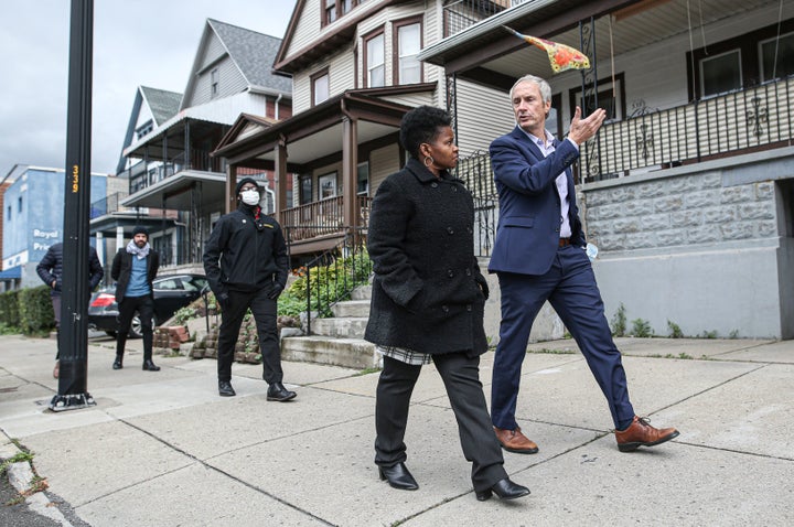 Walton (front left) tours Buffalo small businesses with New York state Sen. Sean Ryan. She says the city's growth under Brown has come at the expense of many residents.