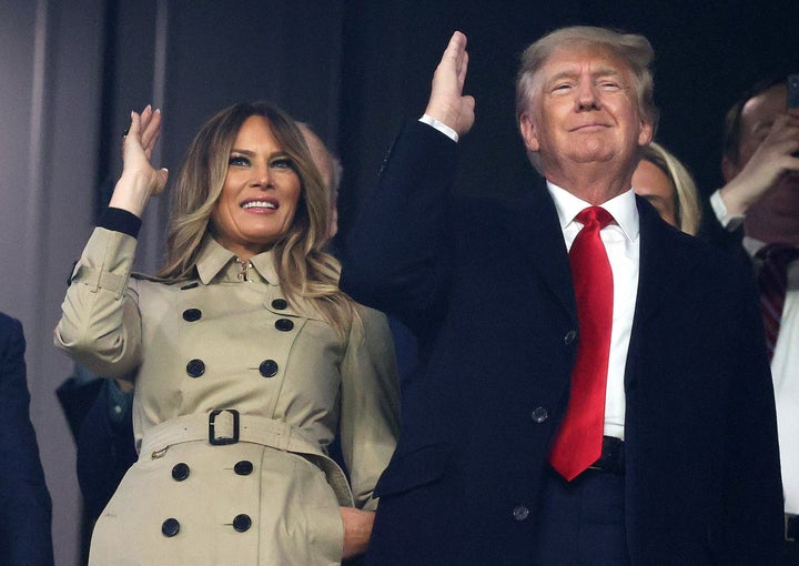 The former first couple happily do the controversial "chop" before game four of the World Series between the Houston Astros and the Atlanta Braves.