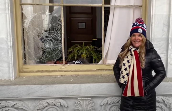 Jenna Ryan poses at the U.S. Capitol during the Jan. 6 attack.