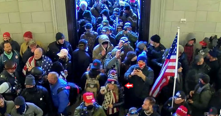 Jenna Ryan (center) enters the Capitol with the mob.