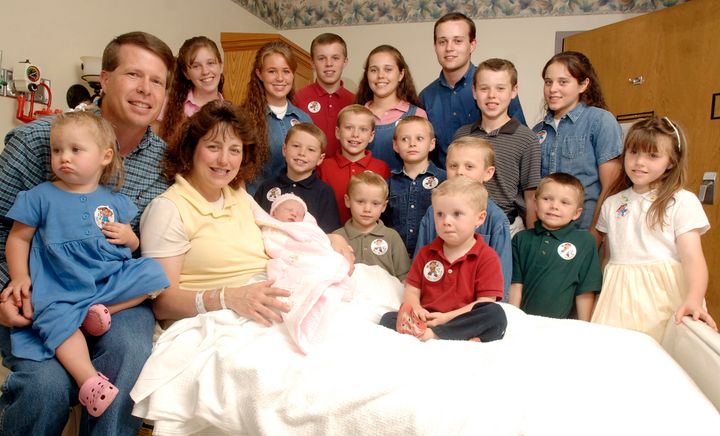 Jim Bob Duggar is seen with his wife, Michelle Duggar, and children after the birth of her 17th child in 2007 in Rogers, Ark.