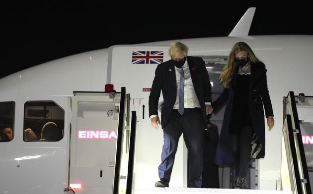 Johnson and his wife Carrie arrive at Rome's Fiumicino Airport ahead of the G20 summit in Rome, before...