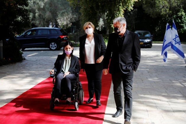 Karine Elharrar, Orna Barbivai and Meir Cohen, politicians from the Yesh Atid party, headed by Yair Lapid, arrive to begin consultations with Israeli President Reuven Rivlin on who might form next coalition government, at the President's residence in Jerusalem April 5, 2021. REUTERS/Amir Cohen