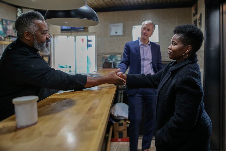 India Walton, right, tours a local business with state Sen. Sean Ryan (D). Progressives were frustrated by some Democrats' decision to stay out of the race after Walton won the primary.
