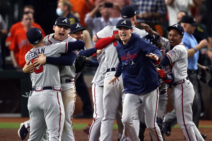 Max Fried #54 of the Atlanta Braves celebrates with teammates after their 7-0 victory against the Houston Astros in Game Six to win the 2021 World Series on Tuesday.