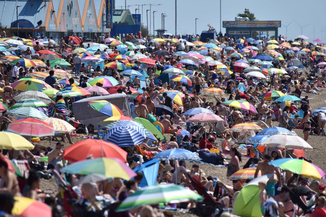 Crowds gather at a beach in Southend-on-Sea in July - a month that saw some of the highest temperatures across the UK in 2021.
