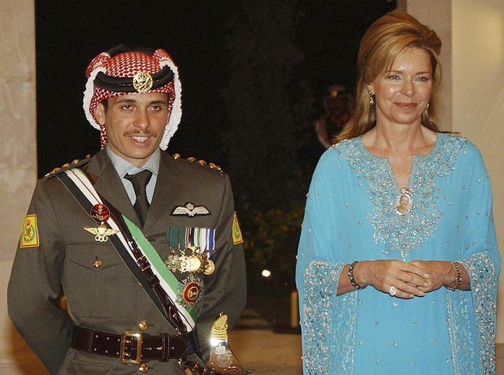 FILE - Jordan's Crown Prince Hamzeh, left, with his mother Queen Noor, right, during his wedding ceremony in Amman, Jordan, on May 27, 2004. The former queen of Jordan says her son, Prince Hamzah, is still not free after having been put under house arrest by his half-brother, King Abdullah II, seven months ago. Queen Noor made the assertion in a tweet late on Wednesday, Nov. 3, 2021, while marking the birthday of one of her granddaughters.