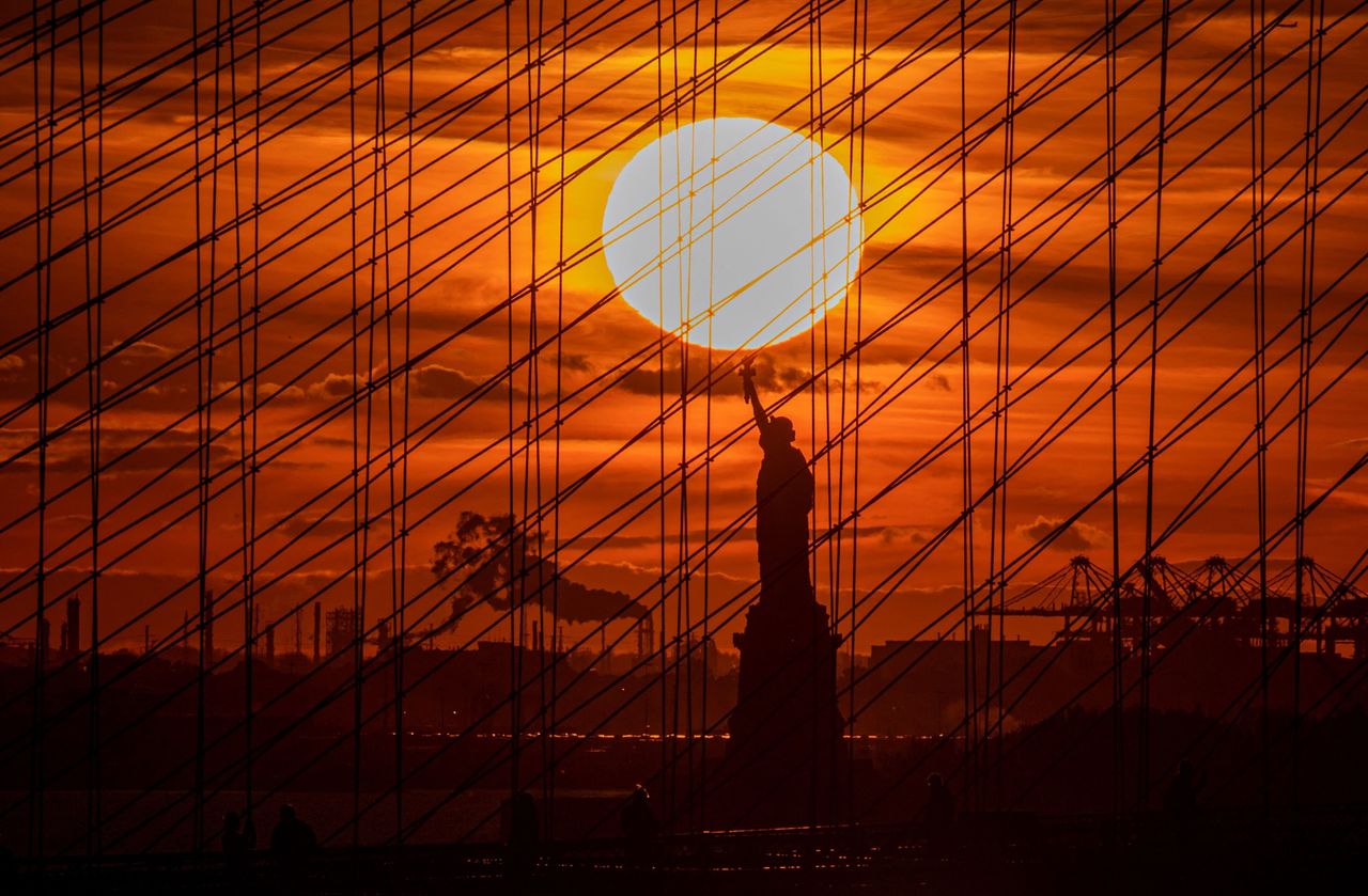 The Statue of Liberty is seen during sunset in New York City, on Nov. 3.