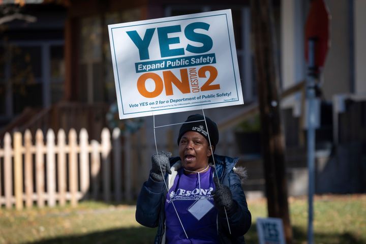 A volunteer urges community members to vote "yes" on a ballot measure that would have replaced the Minneapolis Police Department with a new department of public safety.