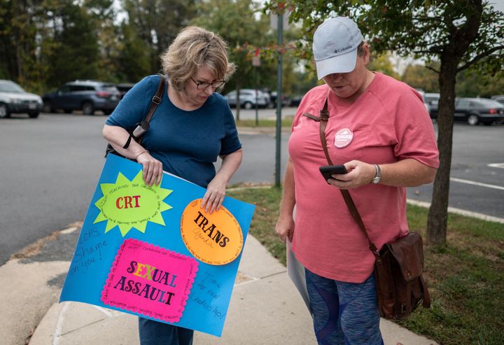 Protesters and activists gather outside a Loudoun County Public Schools board meeting in Ashburn, Virginia, to protest both critical race theory and transgender issues on Oct. 12.