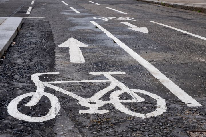 Close-up of a painted bicycle lane on an urban street. No People.