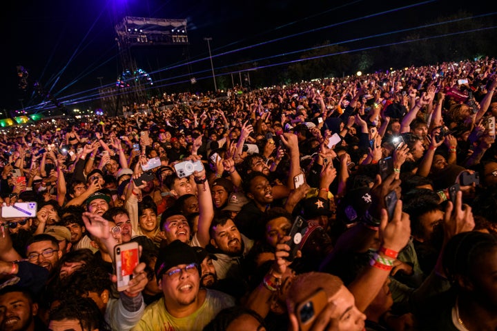 The crowd watches as Travis Scott performs at Astroworld Festival at NRG park on Friday, Nov. 5, 2021 in Houston. Several people died and numerous others were injured in what officials described as a surge of the crowd at the music festival while Scott was performing. Officials declared a “mass casualty incident” just after 9 p.m. Friday during the festival where an estimated 50,000 people were in attendance, Houston Fire Chief Samuel Peña told reporters at a news conference. (Jamaal Ellis/Houston Chronicle via AP)