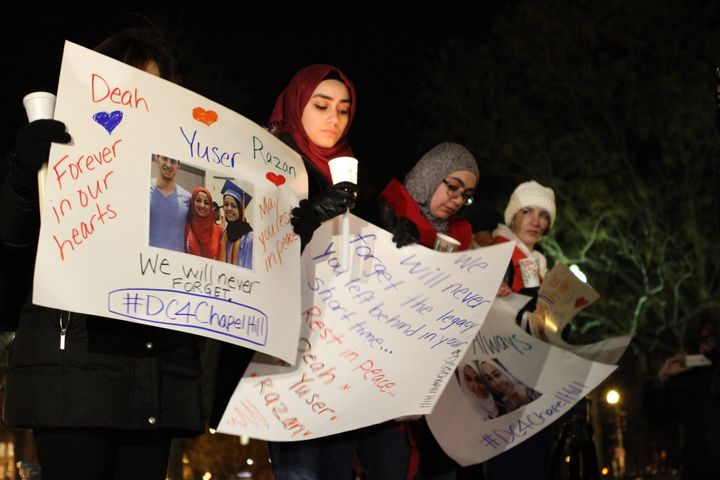 People hold a vigil at Dupont Circle in Washington on Feb. 12, 2015, for Deah Barakat, 23, his wife Yusor Mohammad Abu-Salha, 21, and her sister Razan Mohammad Abu-Salha, 19, who were shot dead in Chapel Hill, North Carolina. 