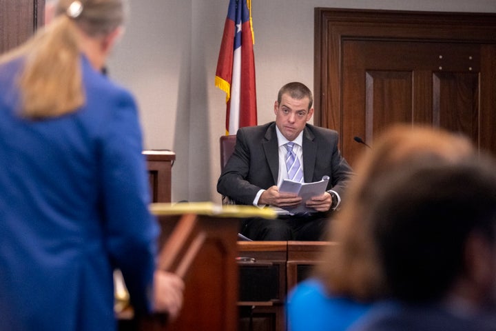 Glynn County Police Officer Jeff Brandeberry sits on the witness stand during the trial of Greg McMichael, his son Travis McMichael, and their neighbor William "Roddie" Bryan in the Glynn County Courthouse on Nov. 9, 2021, in Brunswick, Georgia. The three are charged with the February 2020 slaying of 25-year-old Ahmaud Arbery.