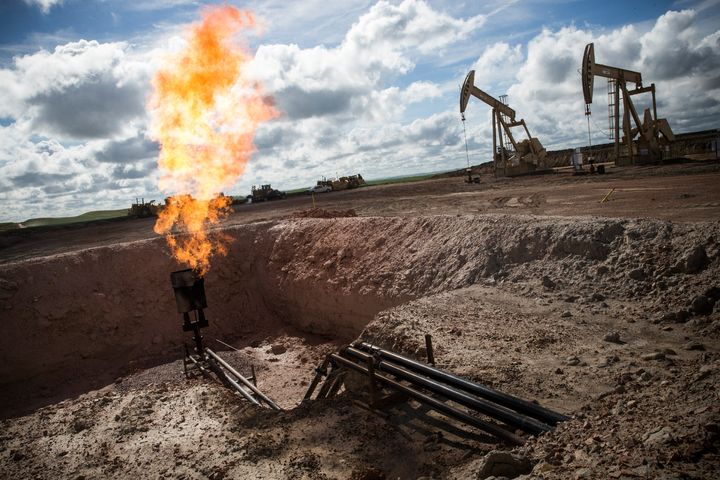 A gas flare at an oil well site outside Williston, North Dakota. Methane, the main component of natural gas, accounts for one-third of all human-caused planetary warming.