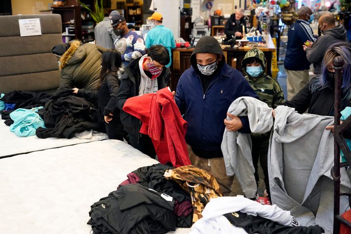 Texans shelter in a furniture store in Houston after a massive winter storm in February knocked out heat and electricity for millions of residents.