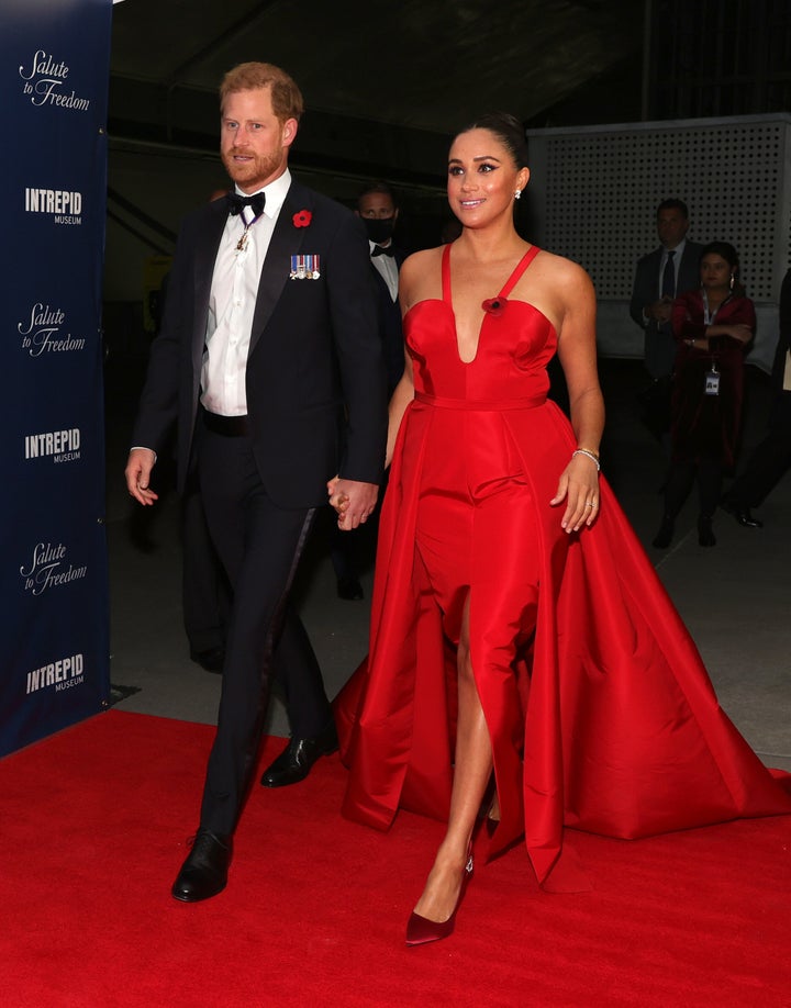 The Duke wore a classic black tux for the event, while the Duchess of Sussex donned a red Carolina Herrera dress.